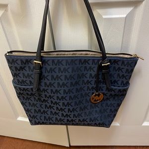 Michael Kors navy blue fabric purse with two outside pockets